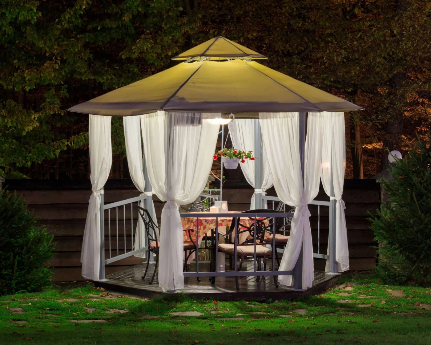 Illuminated gazebo in backyard in San Pablo, CA by The Home Living Company