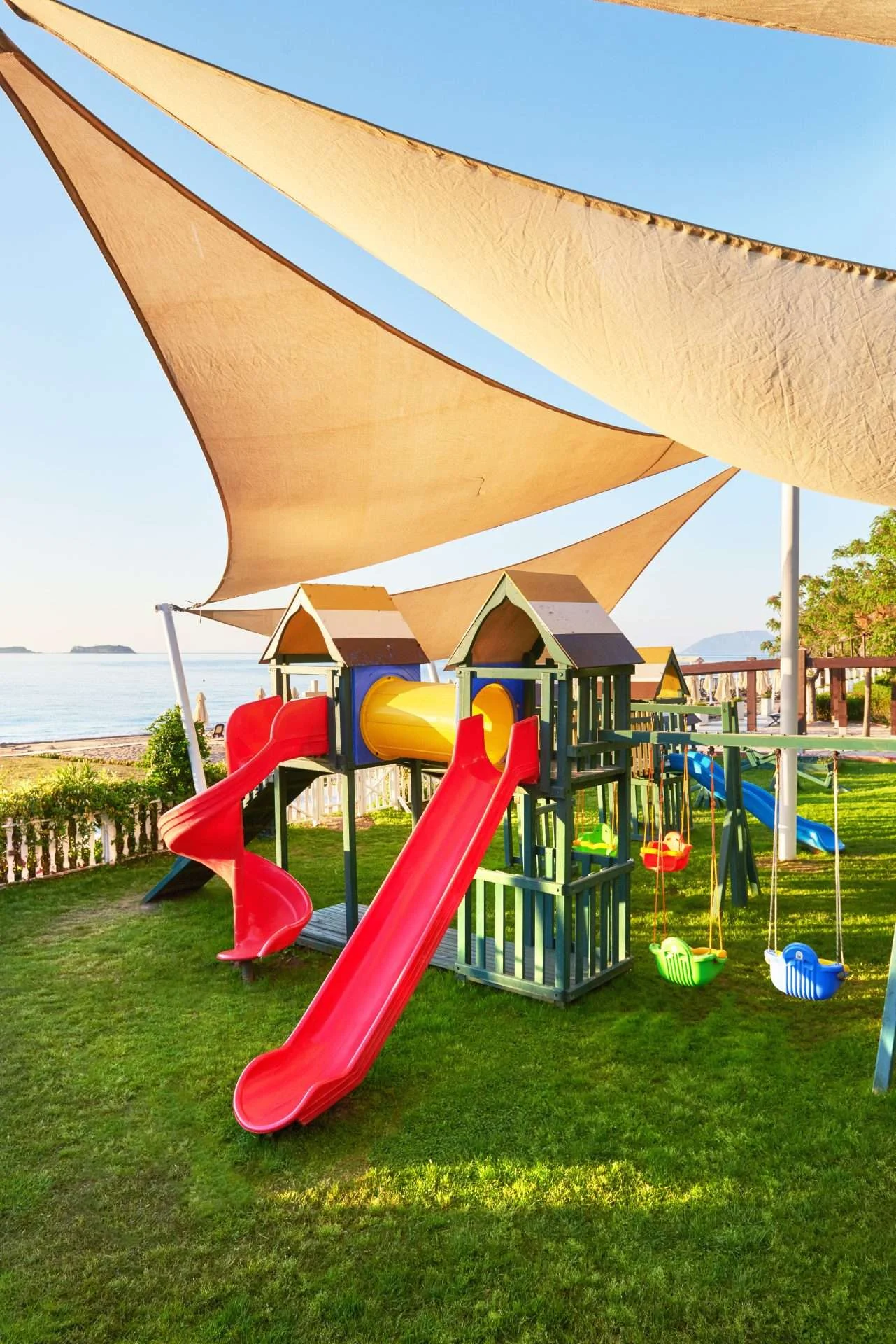 Sail shades installed above backyard playground in Lafayette, CA | The Home Living Company