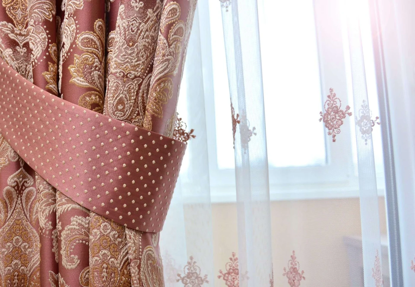 Close up view of gorgeous pink drapes on window in San Rafael, CA | The Home Living Company