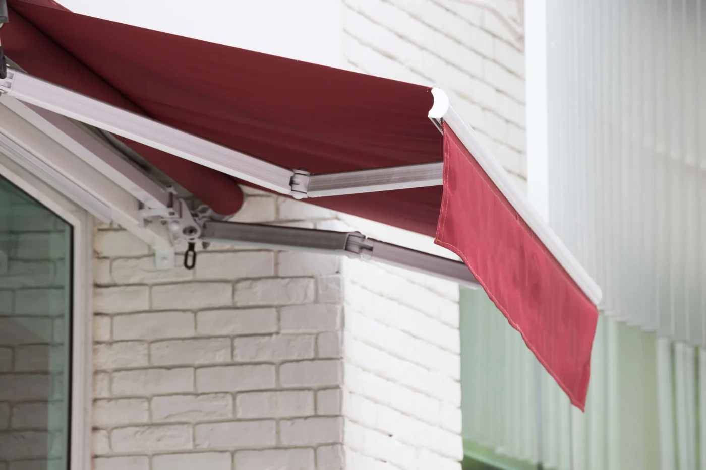 Red retractable awning over Napa, CA patio