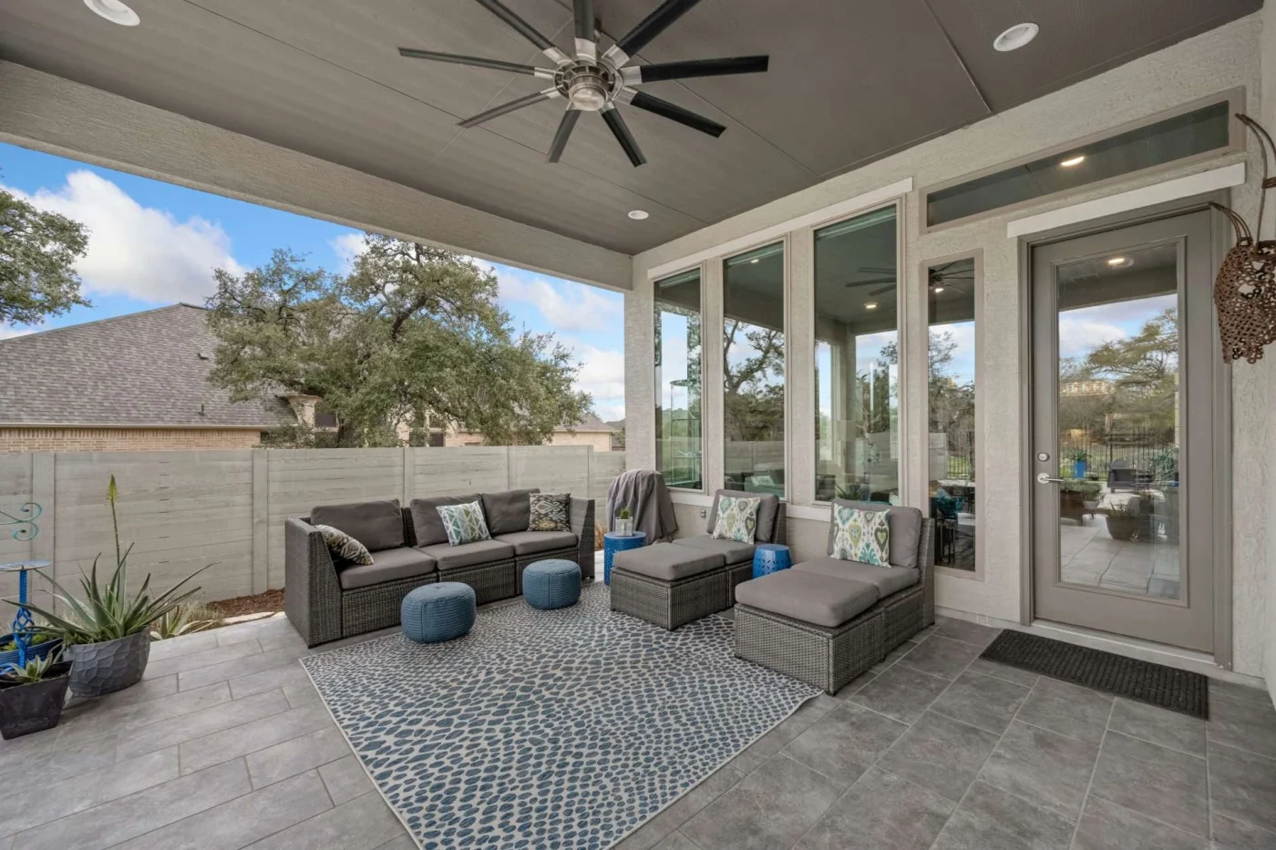 Patio with patio cover and furniture in San Pablo, CA by The Home Living Company