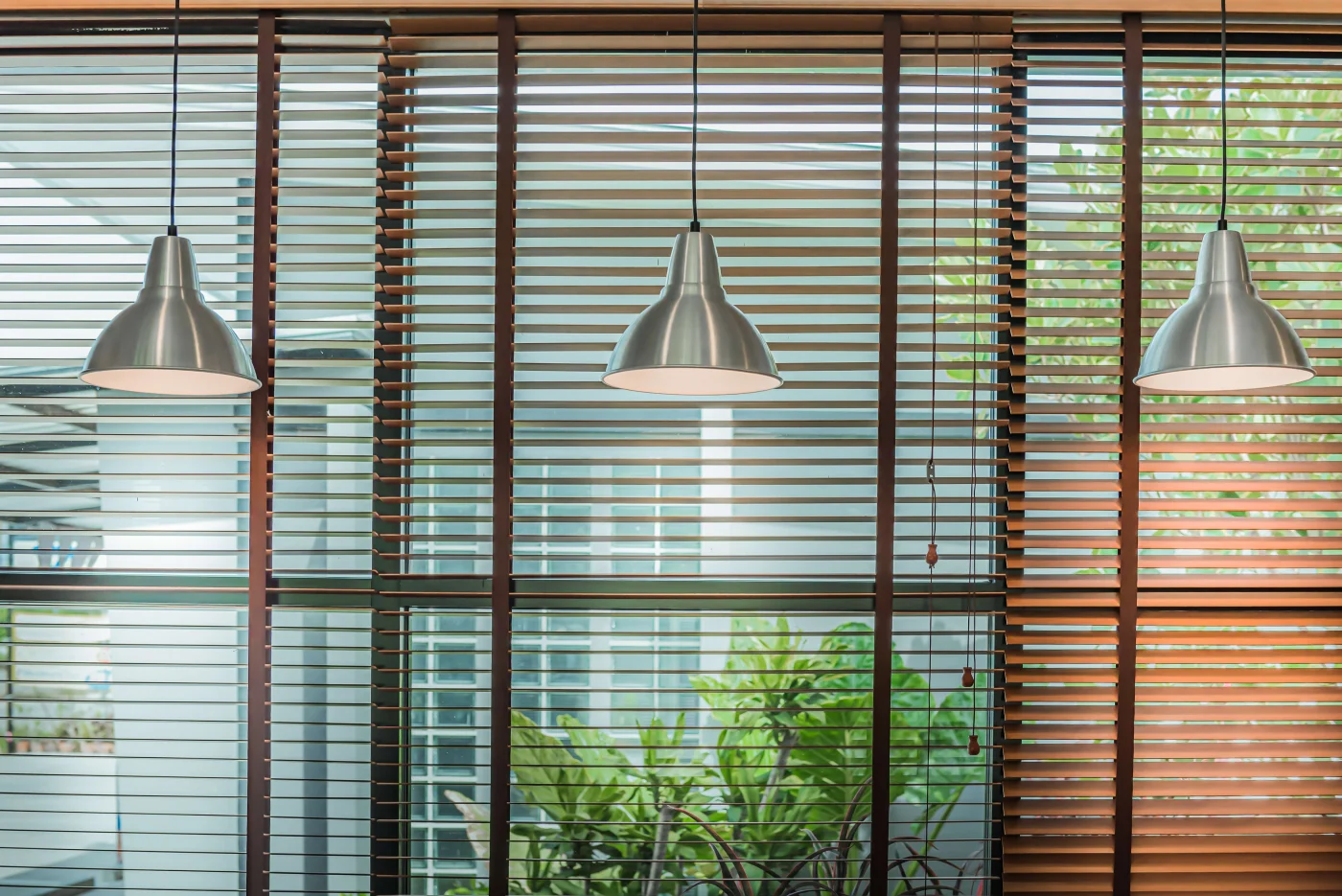 Wood blinds with hanging lights in Napa, CA home