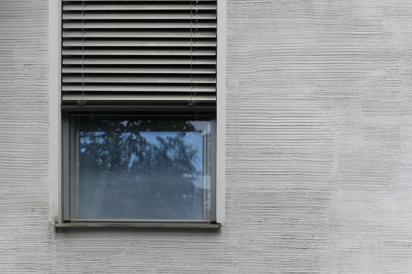 Security shutter installed on exterior of home window
