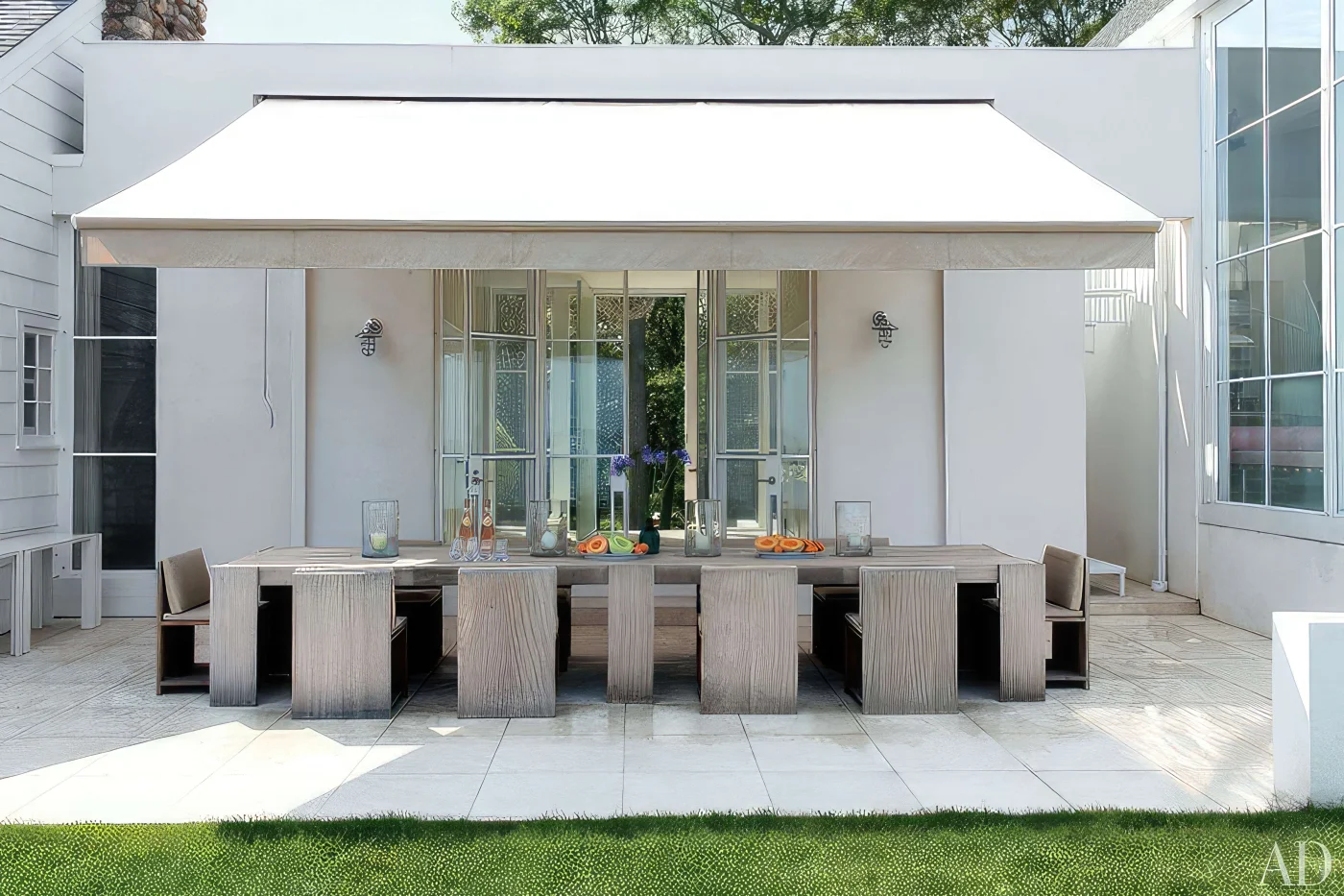 White awning covering large outdoor table for gatherings