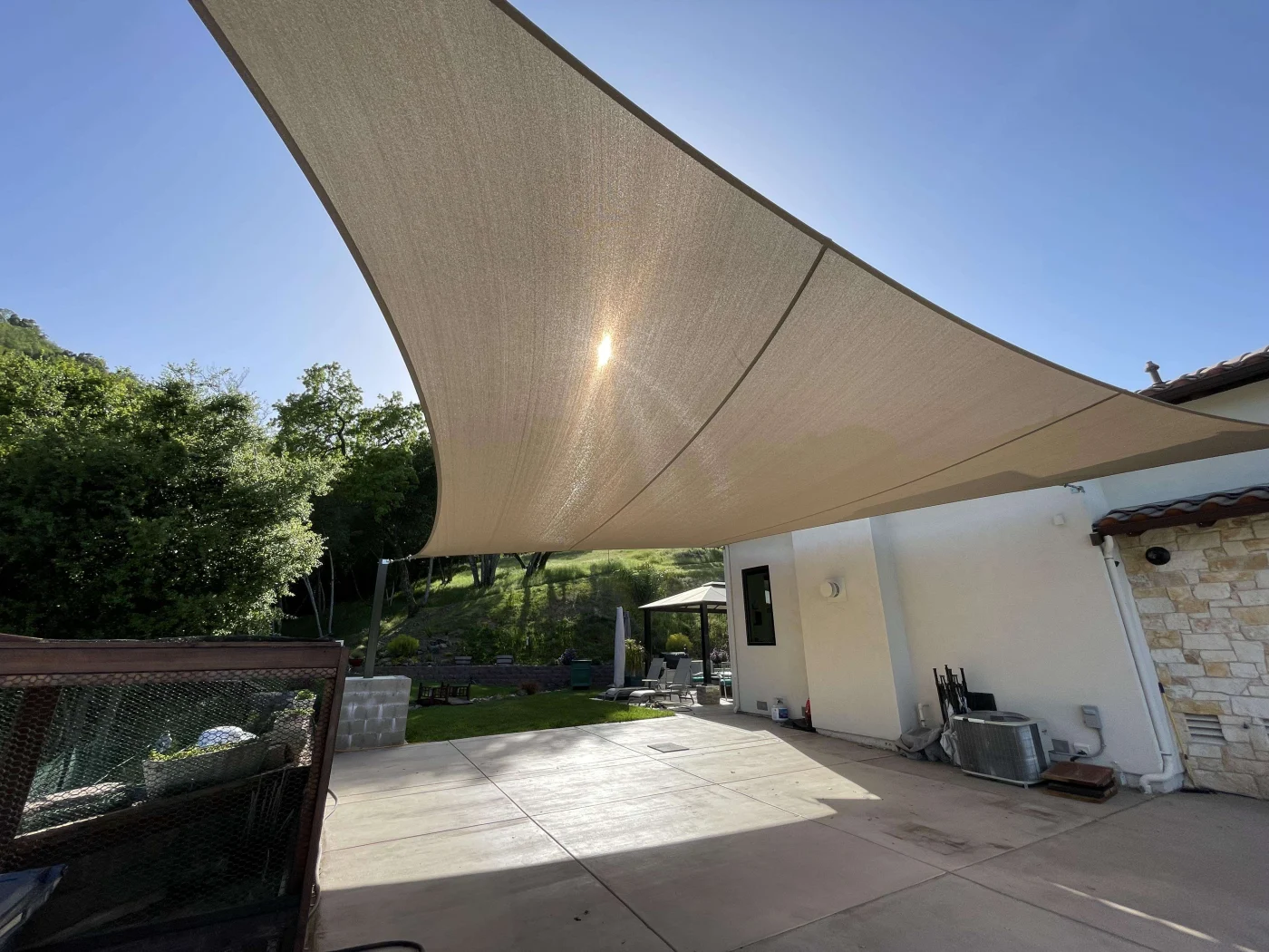 Affordable Patio Covers And Shades | Lafayette, CA | Home Living Outdoor Spaces A dramatic, light brown Australian sail shade over a greater San Francisco Bay area patio in CA