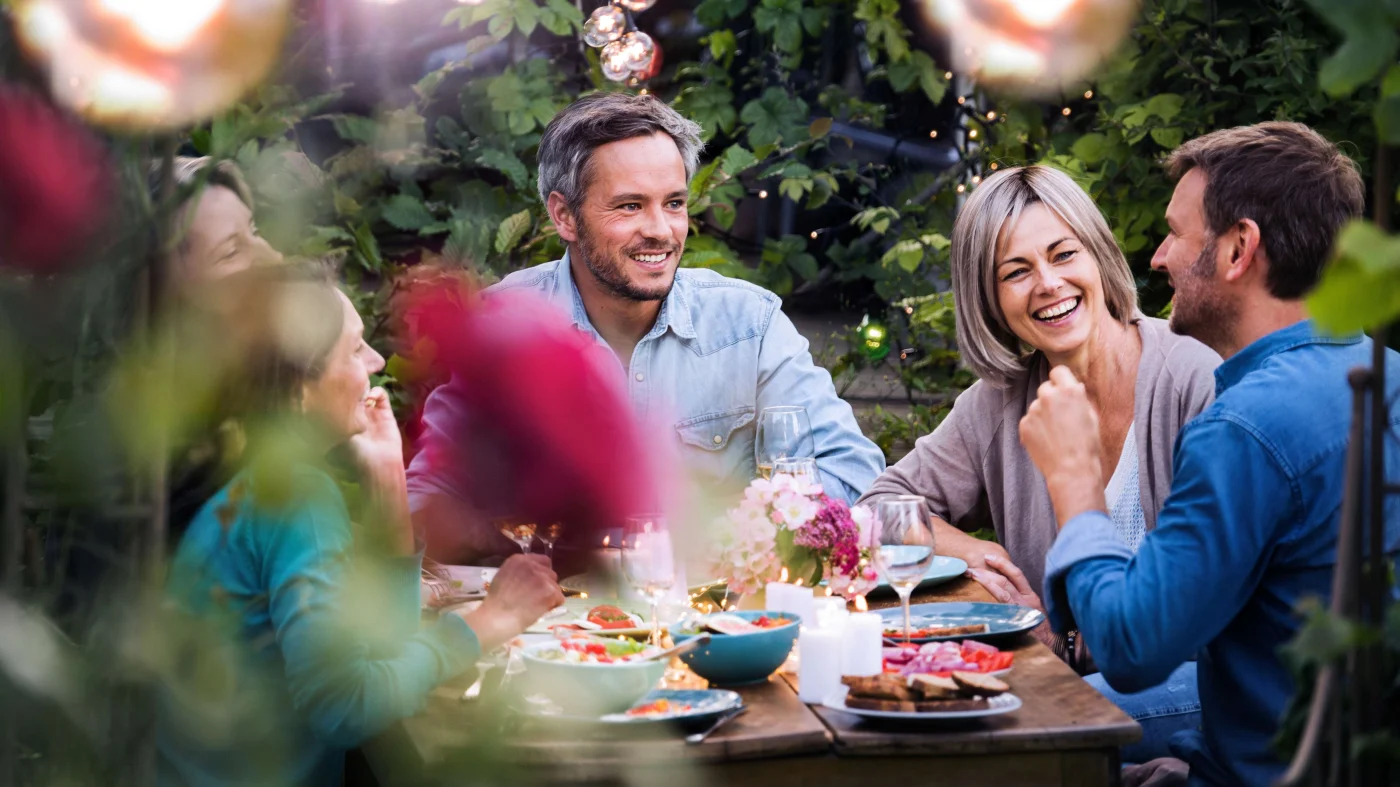 Outdoor Shading Solutions San Francisco Bay Area The Home Living Company A group of people sit around a patio table enjoying the outdoor space